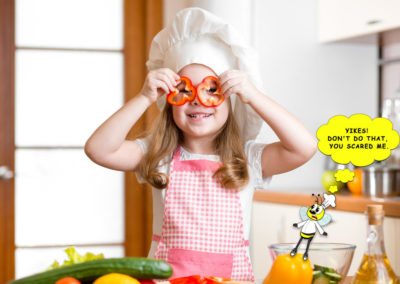 Girl-making-salad_fun-with-peppers